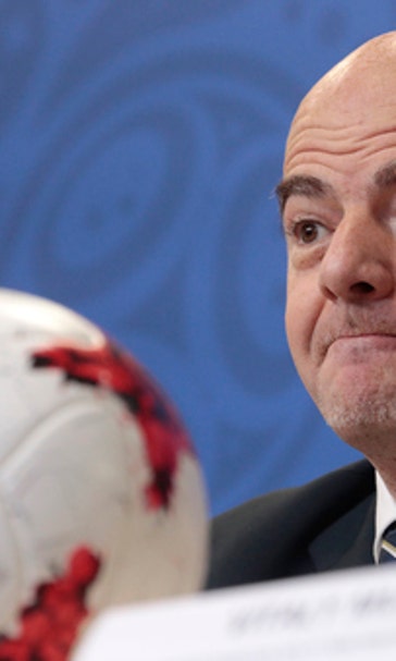 Russia praised for football hosting as doping casts shadow